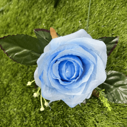 Light blue deluxe rose with dark green leaves